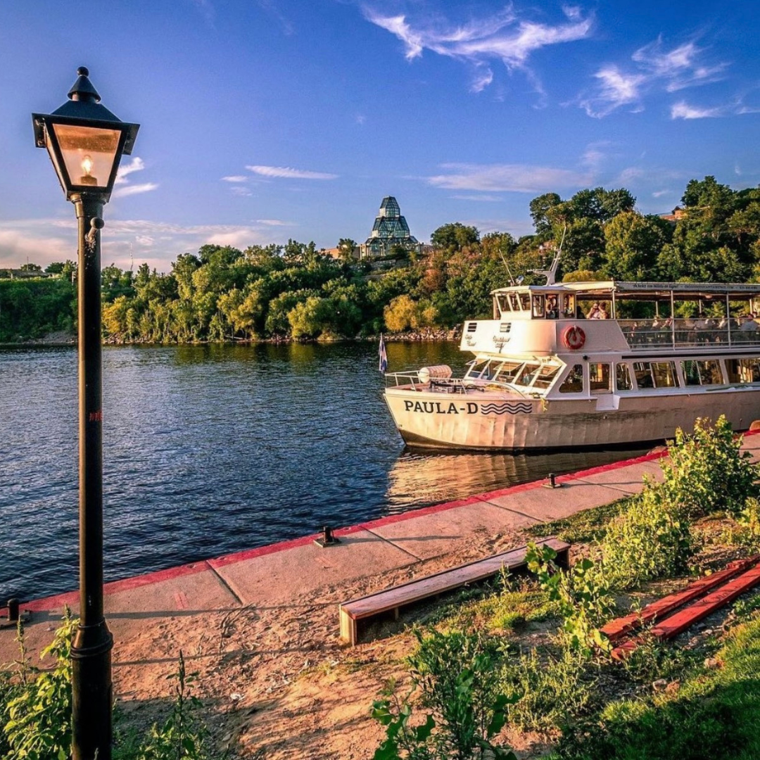 Father's Day Brunch Cruise boat docked at Ottawa Dock with scenic views and evening light.