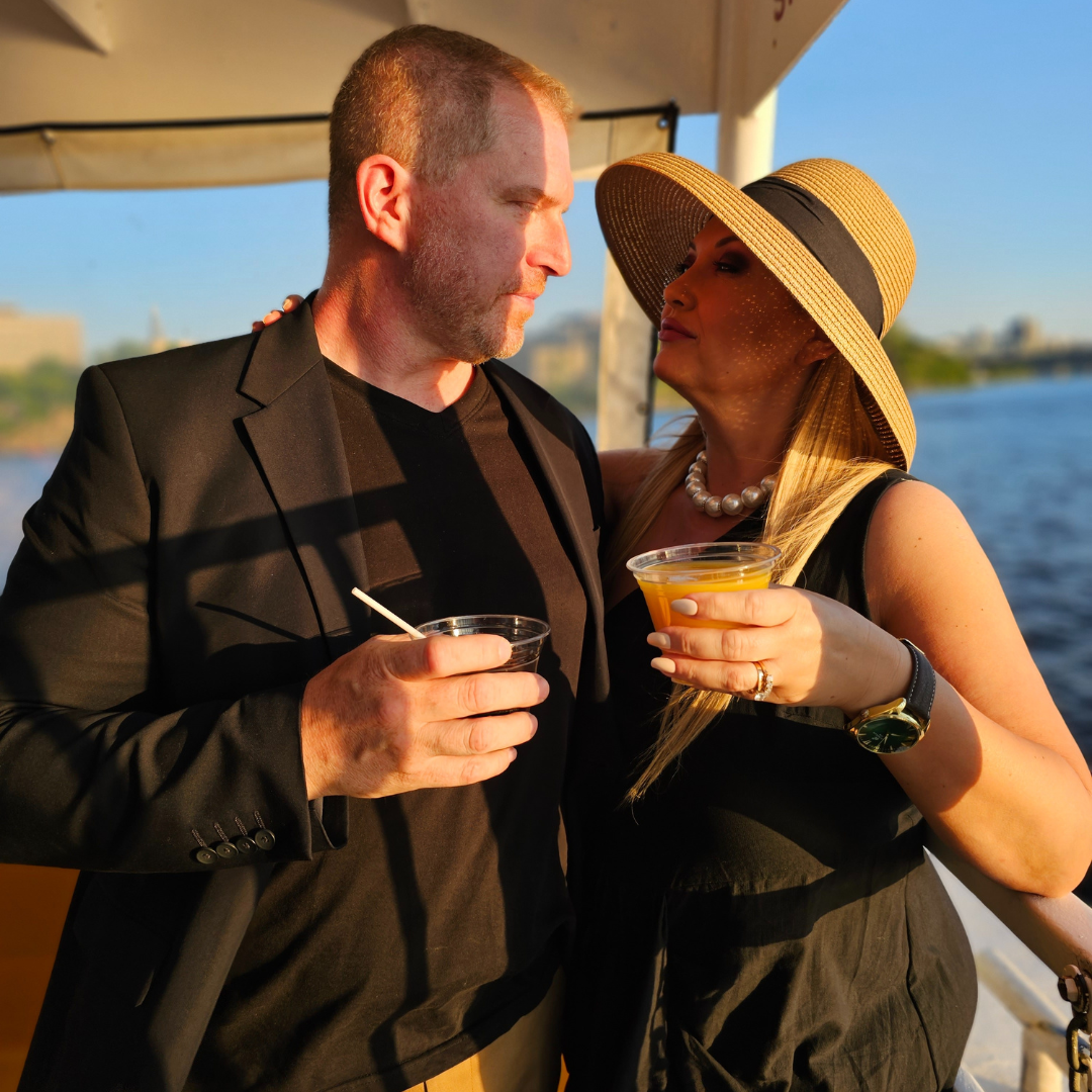 a couple enjoying their summer boat cruise on the Signature River Cruise in Ottawa Gatineau